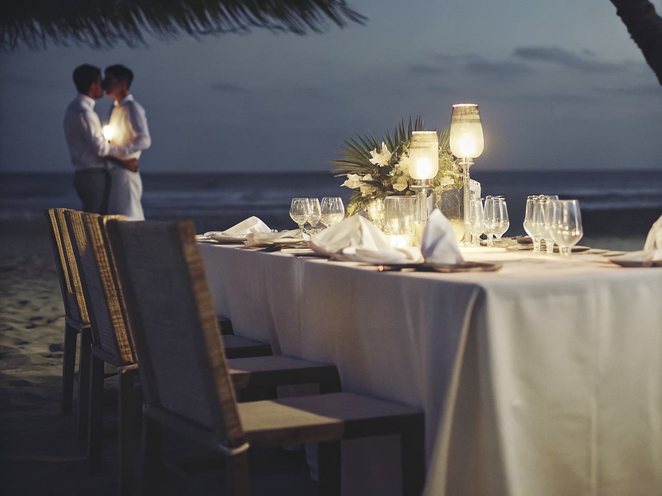 Elegant private dinner table setup on a Costa Rica beachside villa terrace at sunset