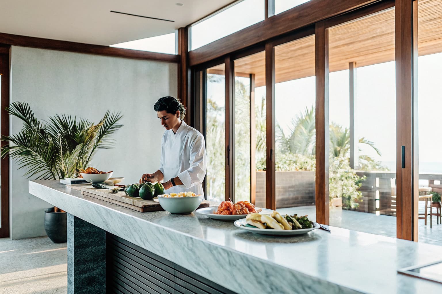 Professional private chef cooking in an elegant Costa Rica villa kitchen